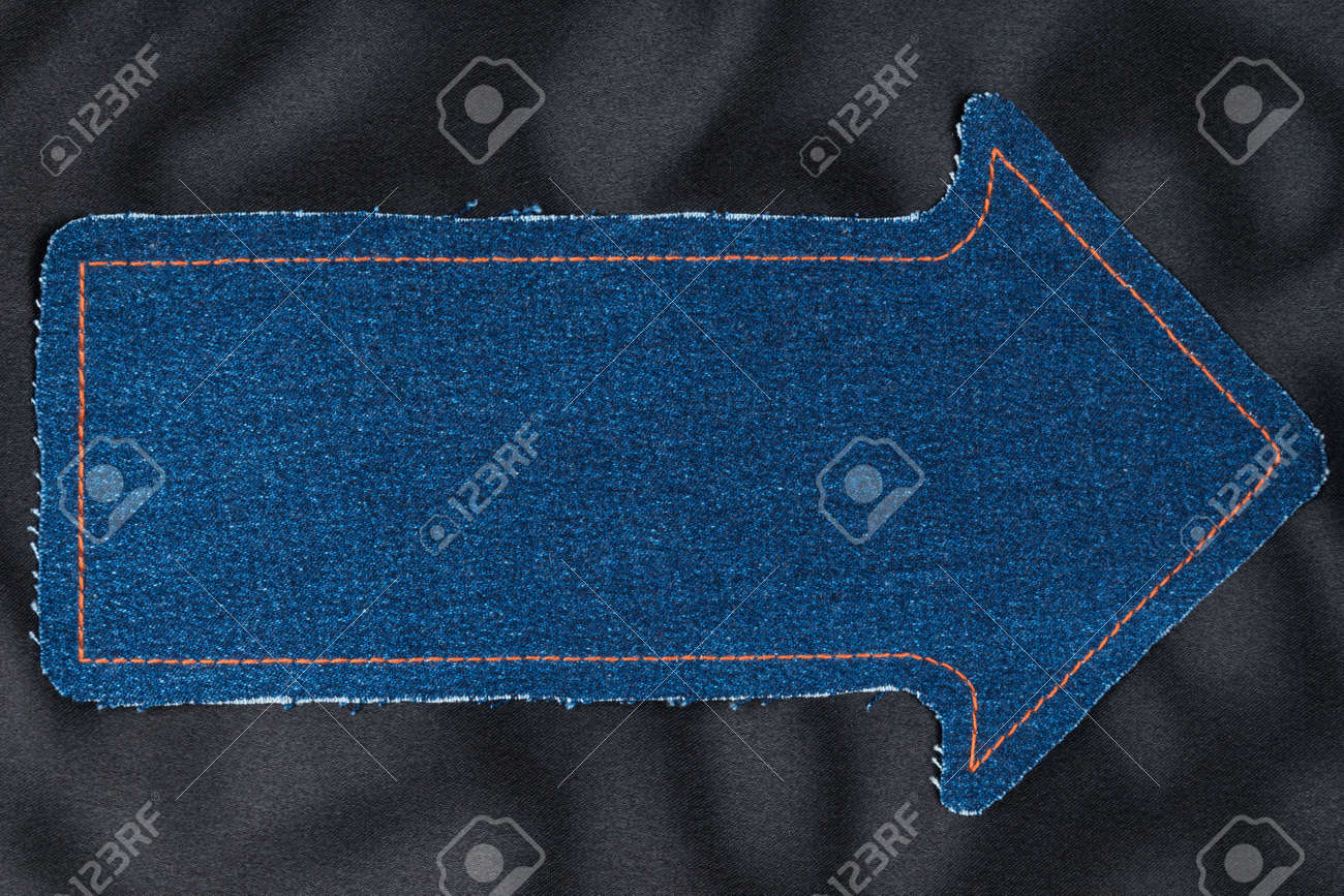 black jeans with yellow stitching