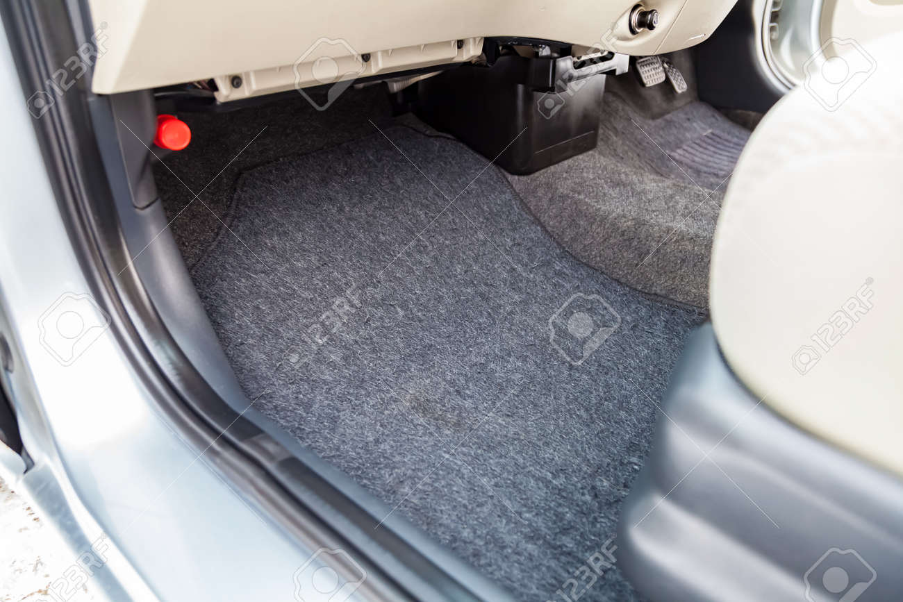 Clean car floor mats of black carpet under front passenger seat in the workshop for the detailing vehicle before dry cleaning. Auto service industry. Interior of sedan. - 140455464 Clean car floor mats of black carpet under front passenger seat in the workshop for the detailing vehicle before dry cleaning. Auto service industry. Interior of sedan. - 140455464