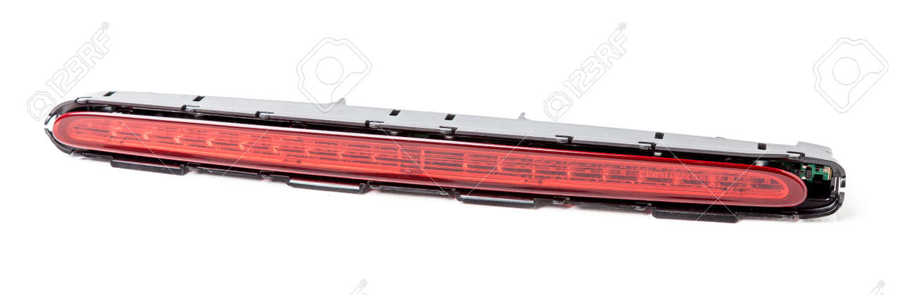 Spare part for sale at an auto-parsing or repair of a car body in service on a white isolated background in a photo studio - LED additional brake light from black and red plastic. - 169051348 Spare part for sale at an auto-parsing or repair of a car body in service on a white isolated background in a photo studio - LED additional brake light from black and red plastic. - 169051348