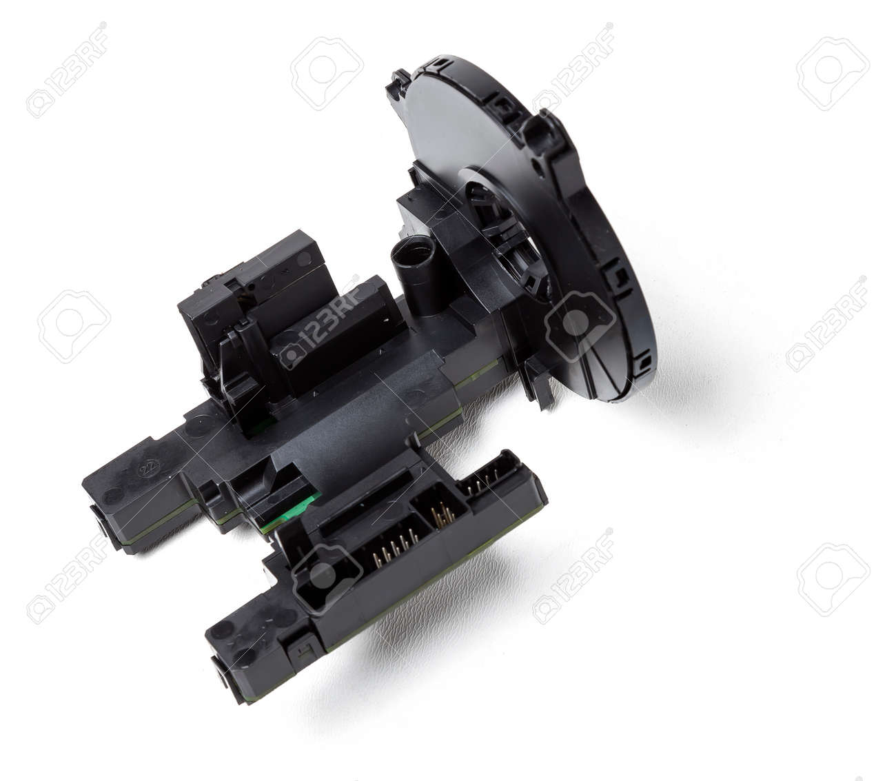 steering angle sensor disassembled on a white isolated background, spare part for car repair or for sale at junk yard. - 169388033 steering angle sensor disassembled on a white isolated background, spare part for car repair or for sale at junk yard. - 169388033