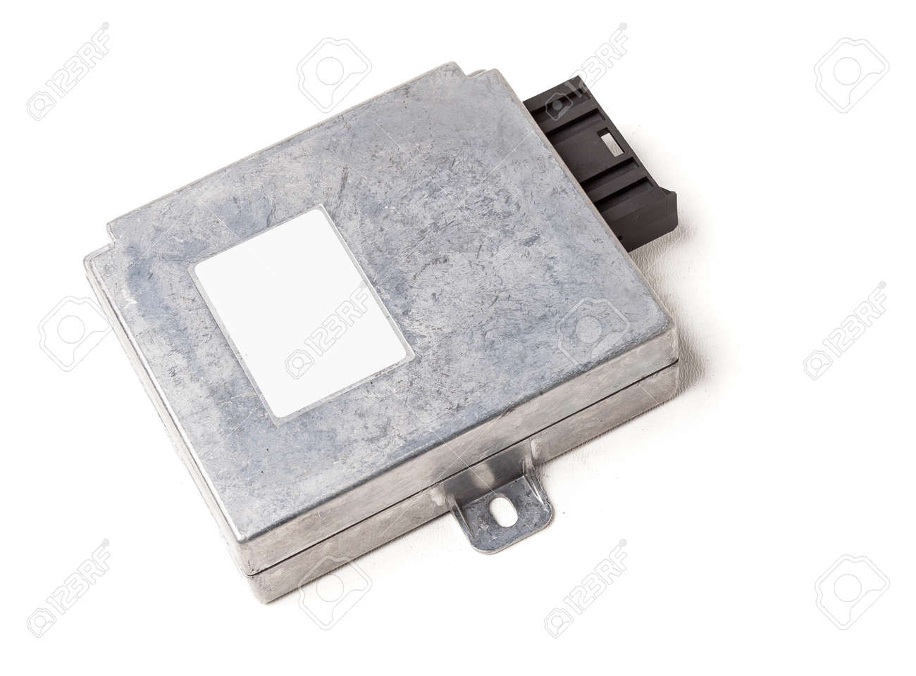 Plastic car engine control unit with metal elements on a white isolated background is the connecting center of various subsystems, units and assemblies. Monitoring the state of the moment. Spare part - 169387993 Plastic car engine control unit with metal elements on a white isolated background is the connecting center of various subsystems, units and assemblies. Monitoring the state of the moment. Spare part - 169387993