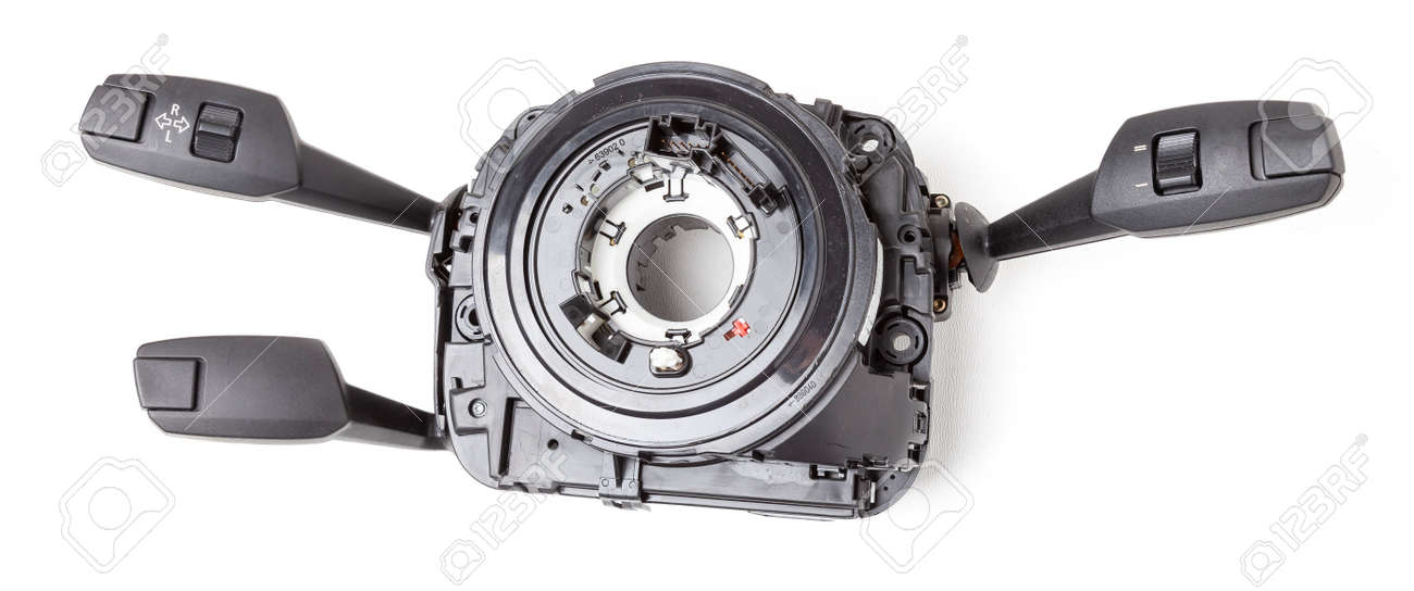 Steering wheel switches for windshield wipers and turn signals with steering angle sensor disassembled on a white isolated background, spare part for car repair or for sale at junk yard. - 169388040 Steering wheel switches for windshield wipers and turn signals with steering angle sensor disassembled on a white isolated background, spare part for car repair or for sale at junk yard. - 169388040