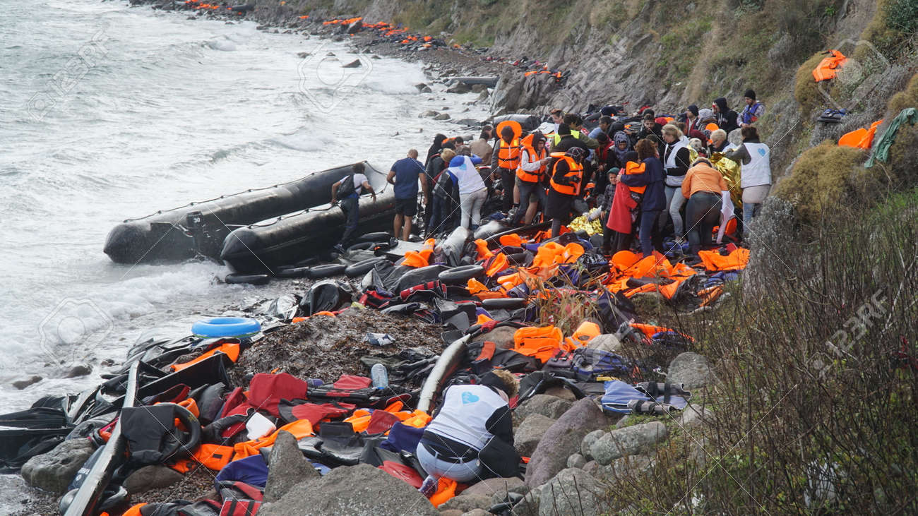Refugees had just arrived to the shore - 52115205 Refugees had just arrived to the shore - 52115205