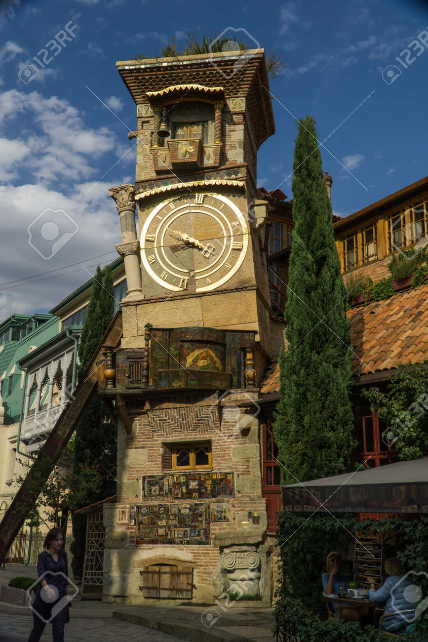 TBILISI, GEORGIA - SEP 25, 2016: The leaning clock tower of Rezo Gabriadze Marionette Theatre. - 77282283 TBILISI, GEORGIA - SEP 25, 2016: The leaning clock tower of Rezo Gabriadze Marionette Theatre. - 77282283