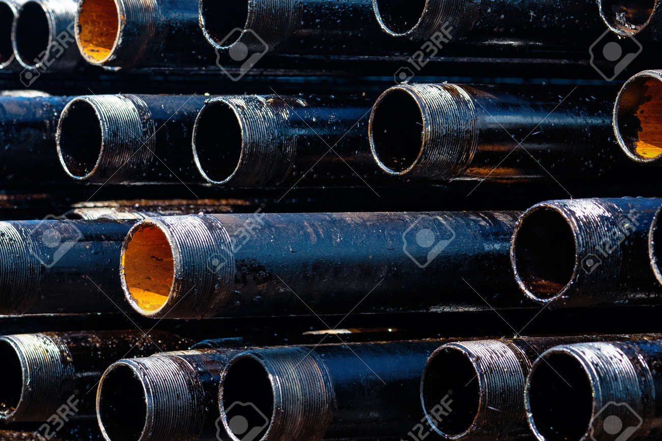 View Of Drilling Pipes Casing And Tubing Stacked At Open Yard Stock Photo Picture And Royalty Free Image Image 128388374
