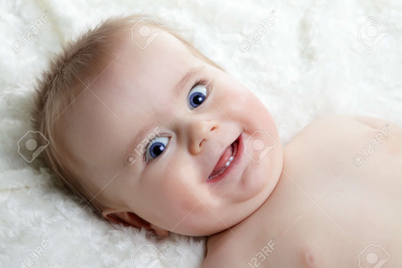 Head Shoot Of Cute Baby With Blue Eyes And Nice Smile Stock Photo Head Shoot Of Cute Baby With Blue Eyes And Nice Smile Stock Photo