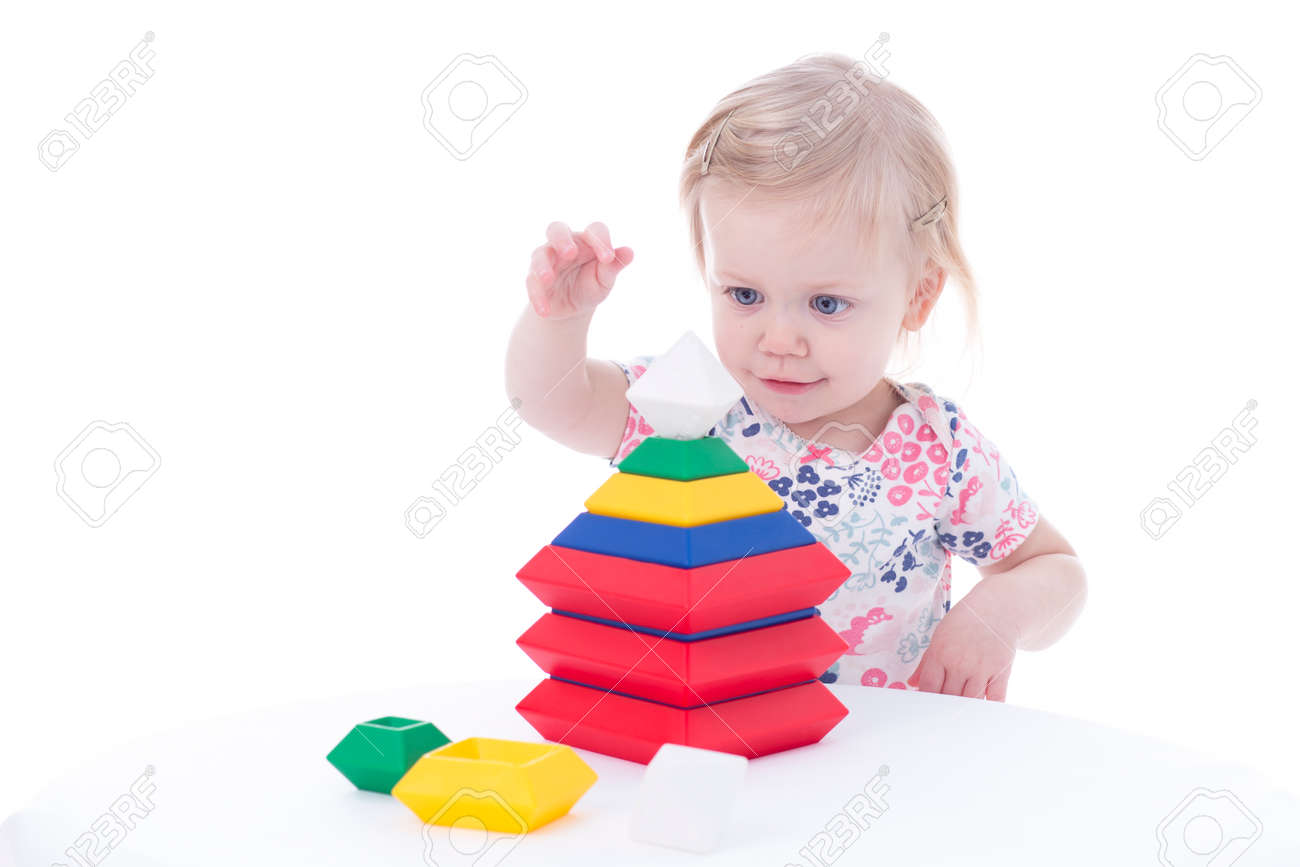 toddler girl stacking blocks