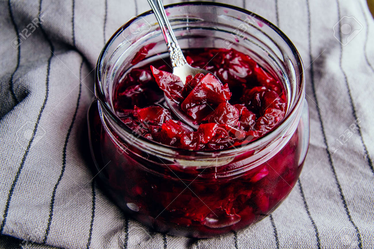 Homemade jam from rose petals in a jar on a dark background - 152811740 Homemade jam from rose petals in a jar on a dark background - 152811740