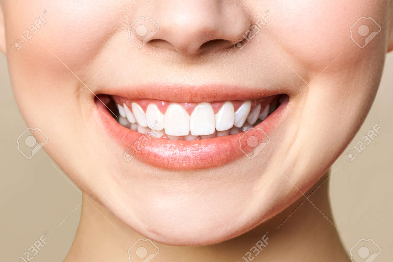 Perfect healthy teeth smile of a young woman. - 135850227 Perfect healthy teeth smile of a young woman. - 135850227