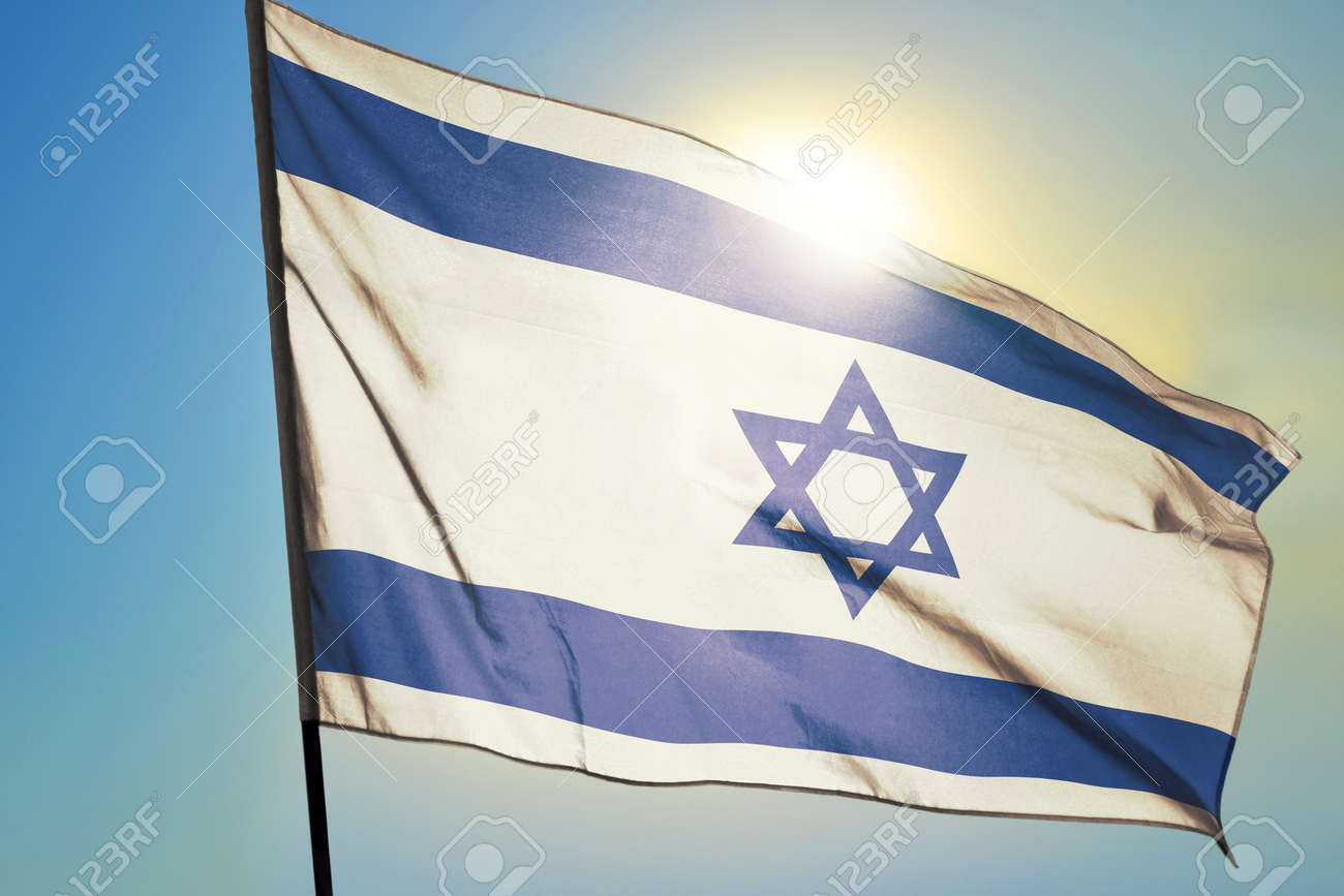 Israel flag waving on the wind in front of sun - 166480080 Israel flag waving on the wind in front of sun - 166480080