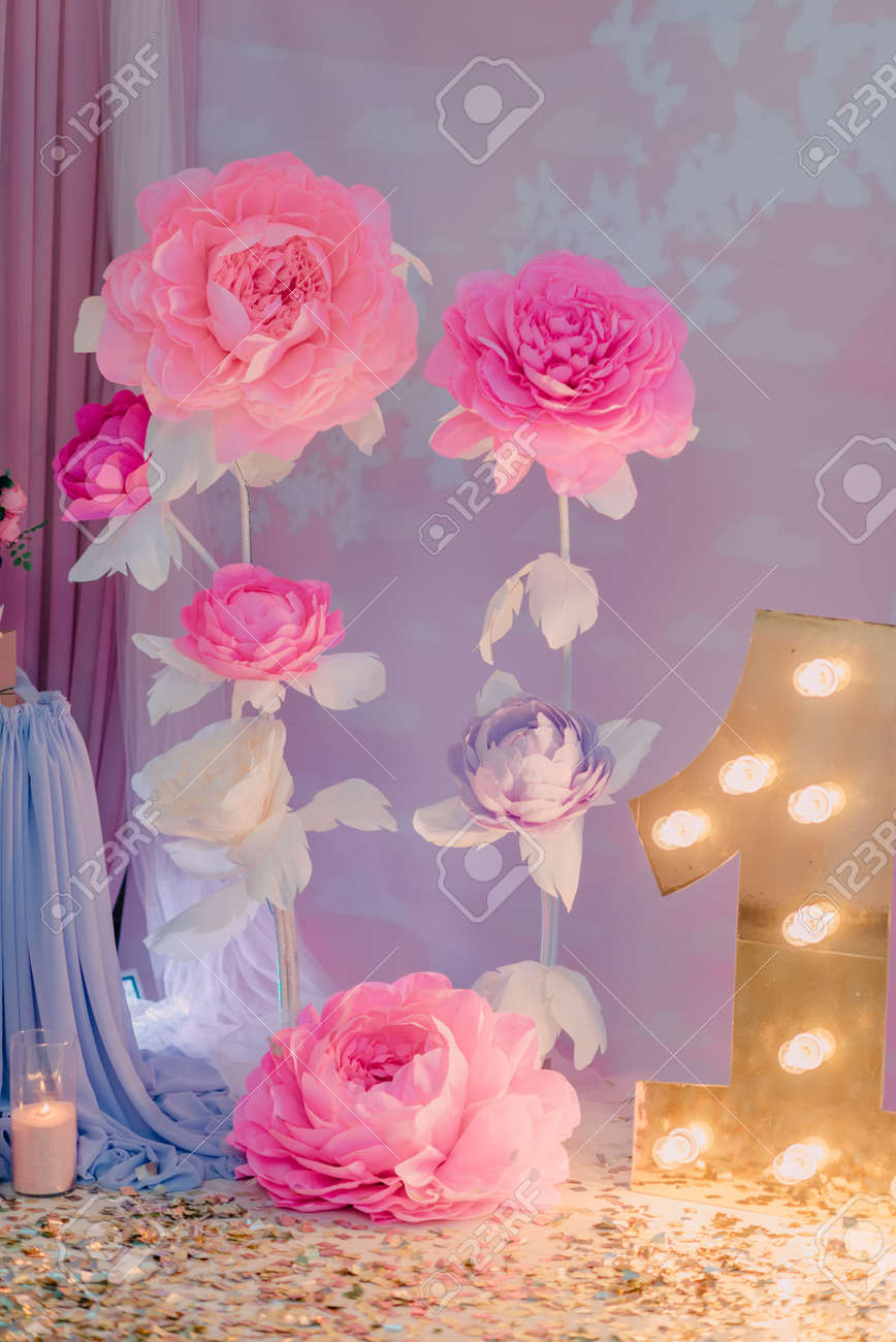 room decoration birthday large paper flowers and a burning unity large paper flower
