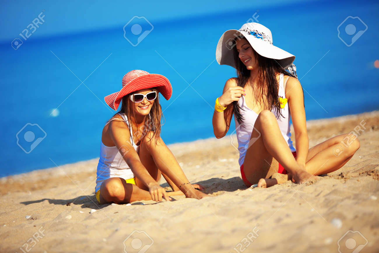 Beautiful Young Girls Resting At The Beach In Hot Summer Stock Photo,  Picture And Royalty Free Image. Image 18576223.