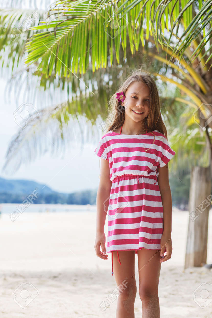 8 Years Old Girl Resting On The Tropical Palm Beach In Thailand In Summer  Stock Photo, Picture and Royalty Free Image. Image 39887846.
