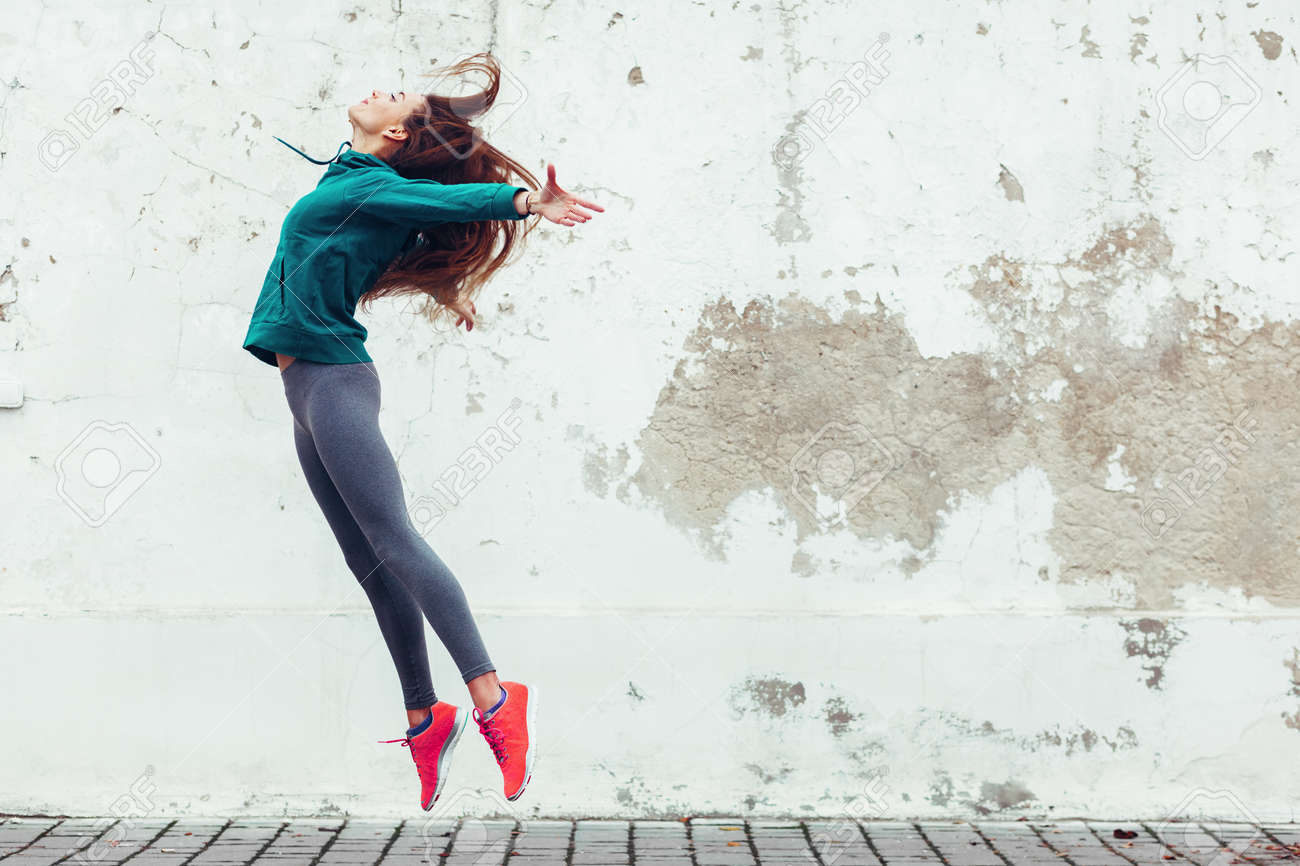 Fitness sport girl in fashion sportswear dancing hip hop in the street, outdoor sports, urban style - 66891210 Fitness sport girl in fashion sportswear dancing hip hop in the street, outdoor sports, urban style - 66891210