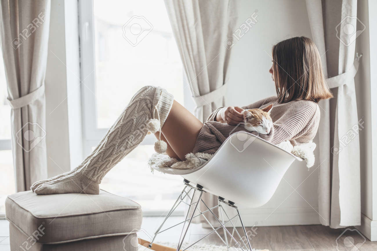 Owner Playing With Cat One Winter Weekend Girl Dressed In Knit Stock Photo Picture And Royalty Free Image Image 131034181
