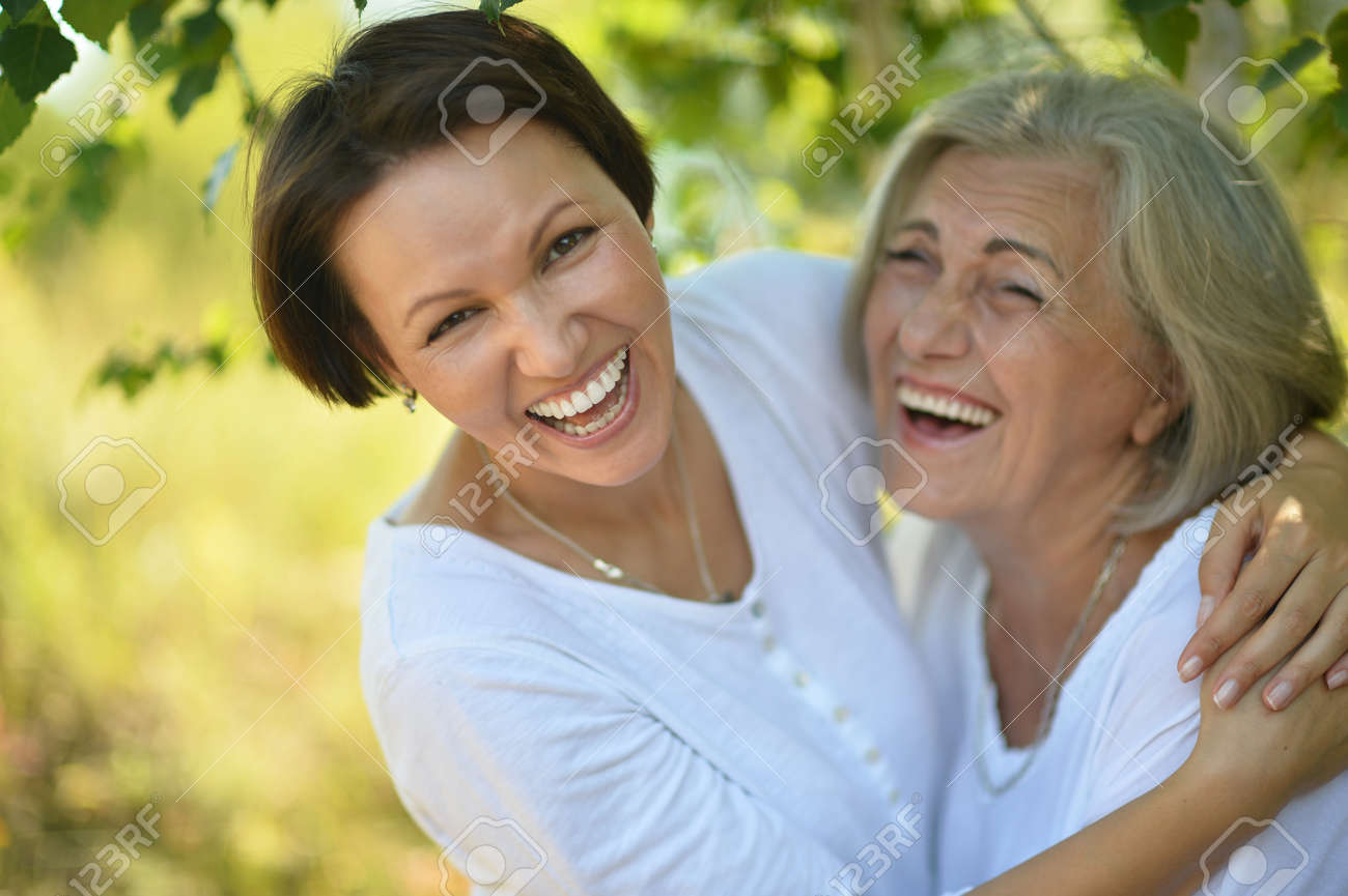 senior Mother and her nice daughter in park - 47929459 senior Mother and her nice daughter in park - 47929459