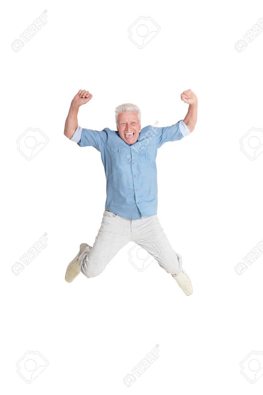 happy senior man in shirt jumping with hands up on white background - 60316956 happy senior man in shirt jumping with hands up on white background - 60316956