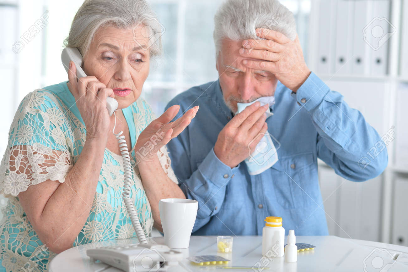 Elderly couple with pills - 73096732 Elderly couple with pills - 73096732
