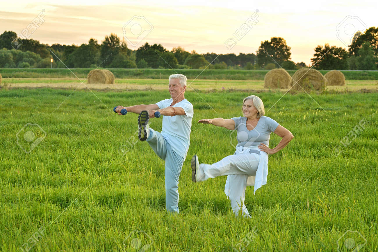 senior couple doing exercises - 94451279 senior couple doing exercises - 94451279