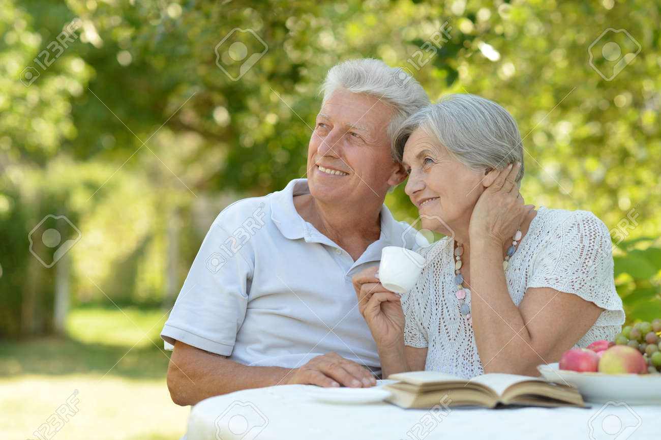 Happy Old Couple With Book Stock Photo, Picture and Royalty Free Image.  Image 118465584.