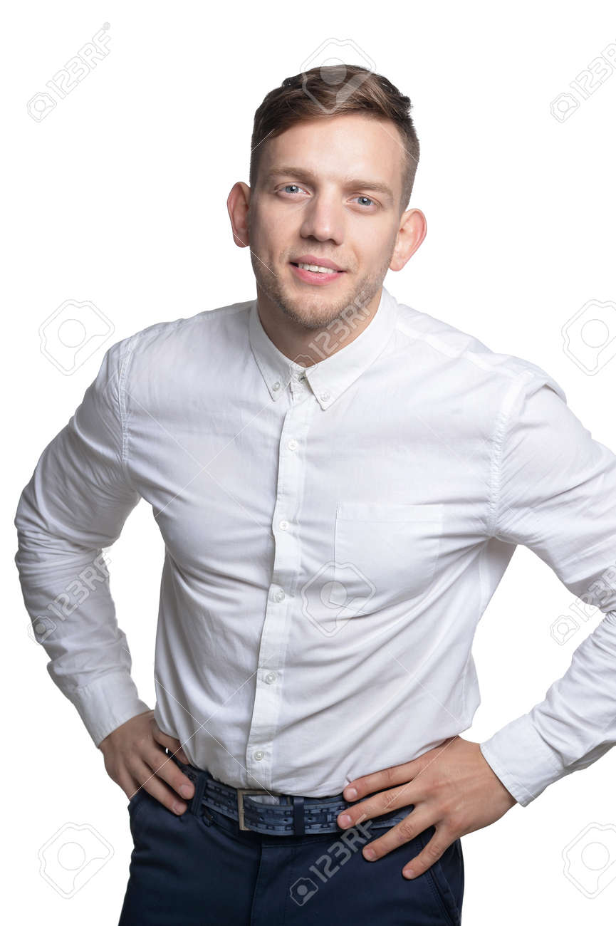Portrait of handsome smiling young man wearing white shirt - 147232461 Portrait of handsome smiling young man wearing white shirt - 147232461