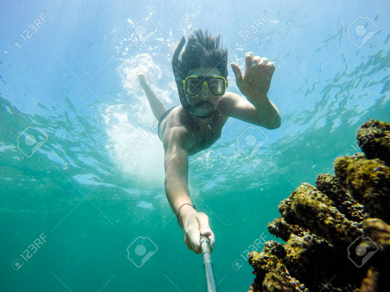 Underwater selfie shot with selfie stick. Deep blue sea. Wide angle shot. - 72142479 Underwater selfie shot with selfie stick. Deep blue sea. Wide angle shot. - 72142479