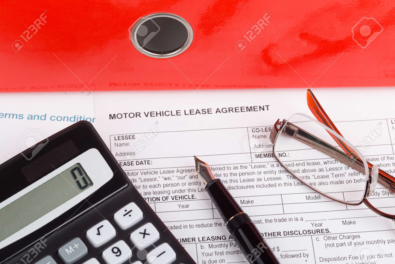 motor vehicle lease agreement with fountain pen and calculator stock photo 49135054