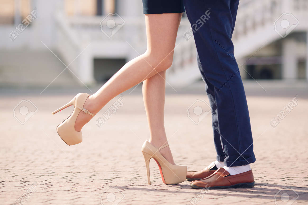 Young Man In A Dark Blue Jeans Brown Shoes And White Socks And