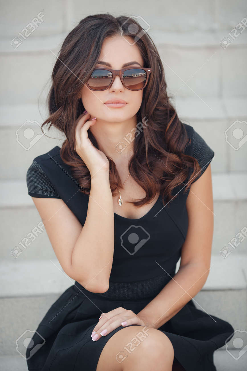 A Beautiful Young Woman Of Asian Appearance With Long Brunette