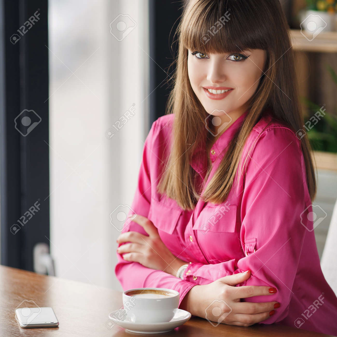 Girl With A Cup Of Hot Tea At A Table In A Cafe Portrait Of Girl With A Cup Of Hot Tea At A Table In A Cafe Portrait Of