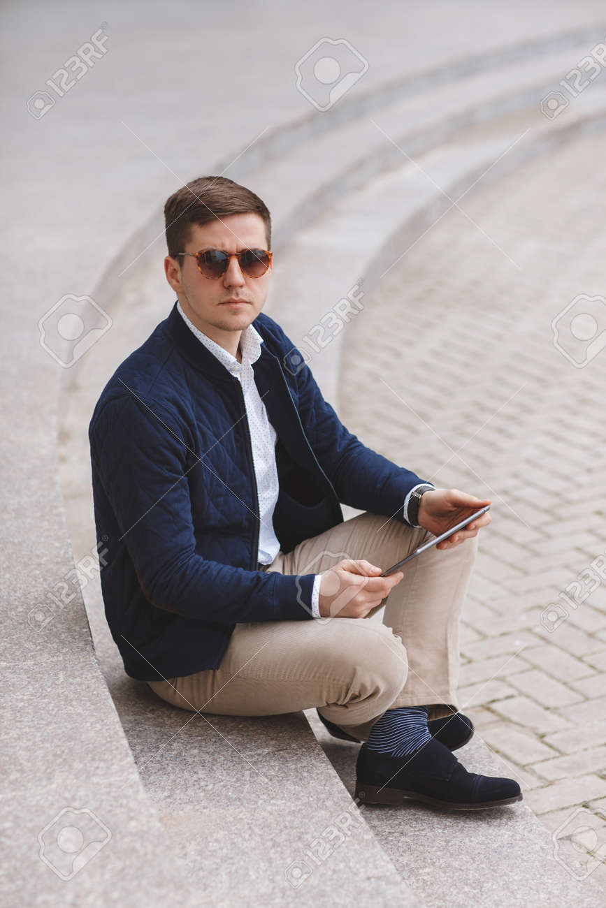 white shirt and light brown pants