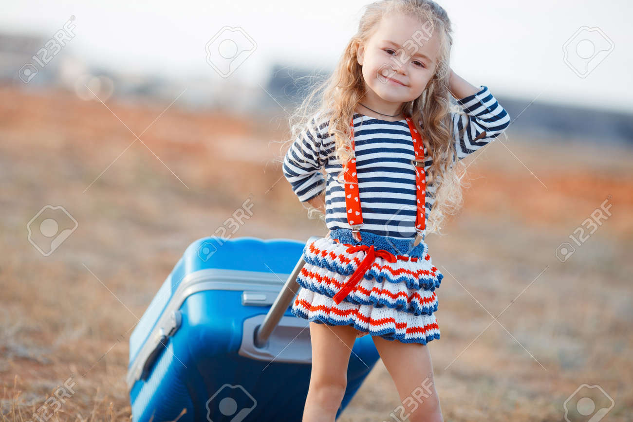little girl with suitcase