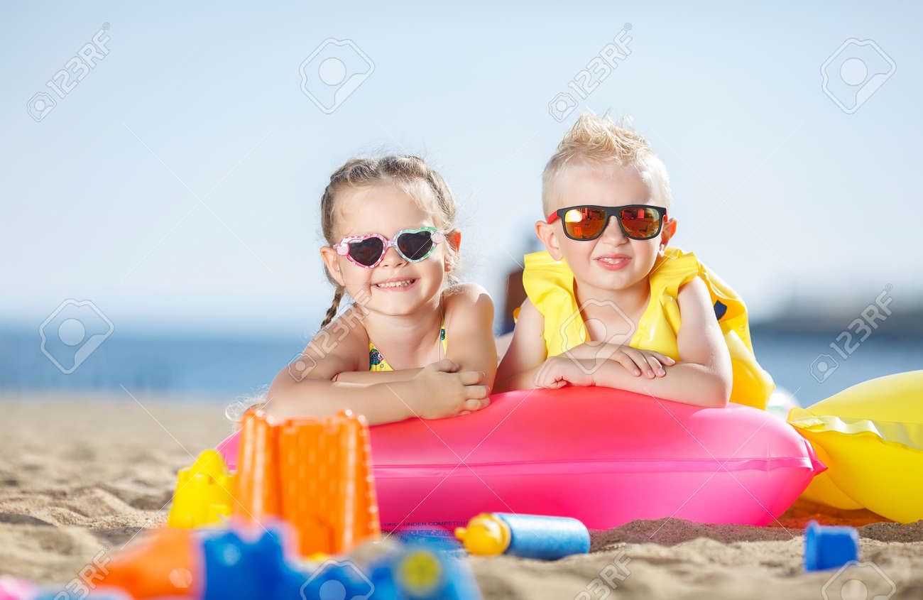 Little Girl With Pigtails And A Little Blond Boy With Short Hair