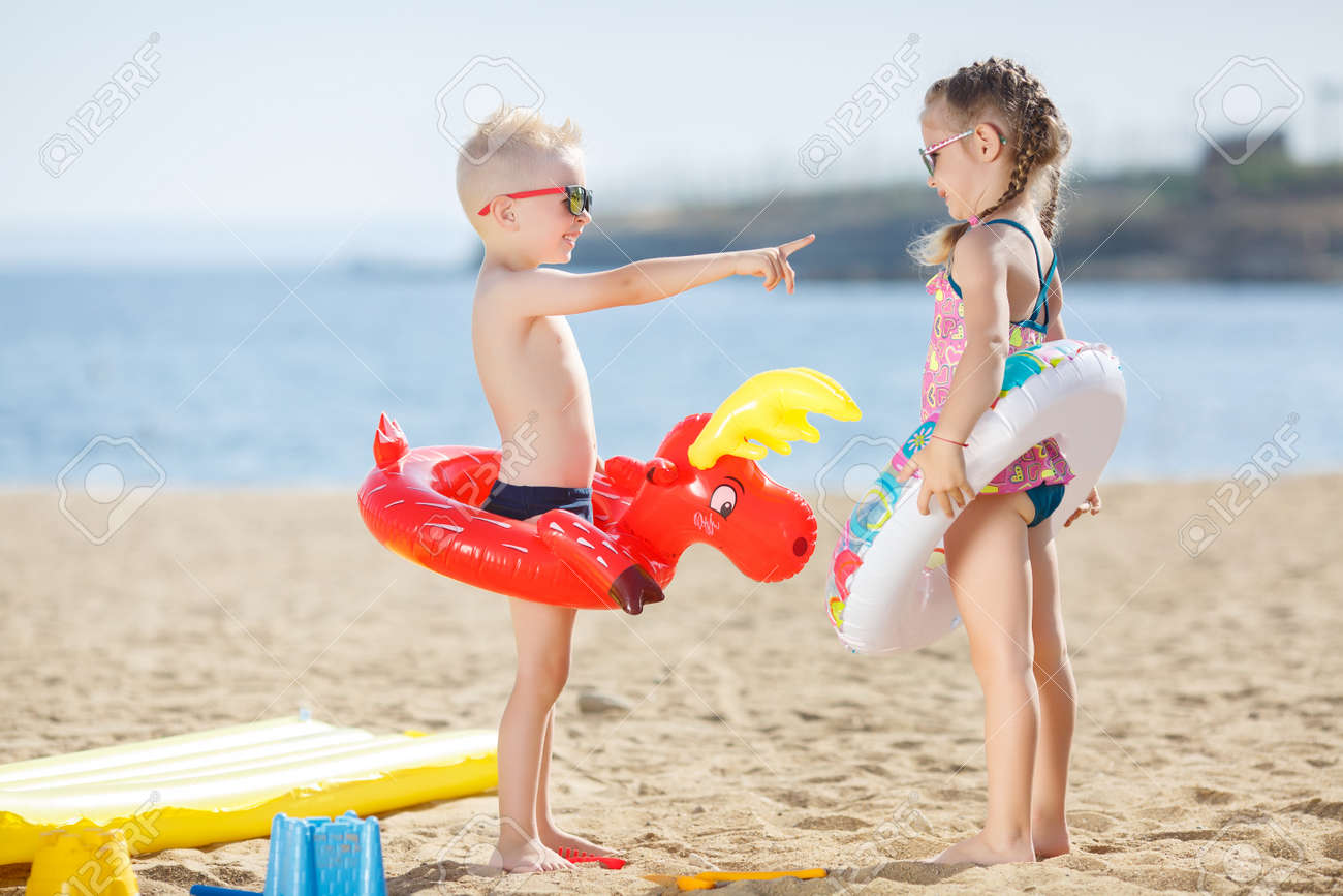 Little Girl With Pigtails And A Little Blond Boy With Short Hair, Brother And Sister, Both Little Girl With Pigtails And A Little Blond Boy With Short Hair, Brother And Sister, Both