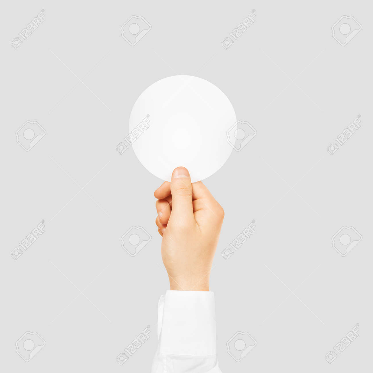 hand holding round blank