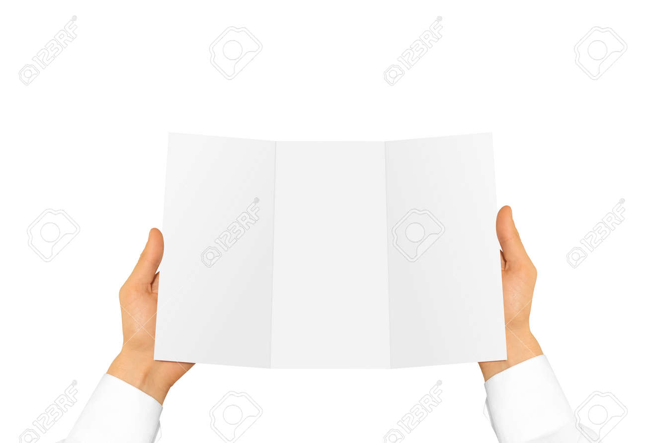 Hand in white shirt sleeve holding blank offset paper in the hand. Stock Photo -