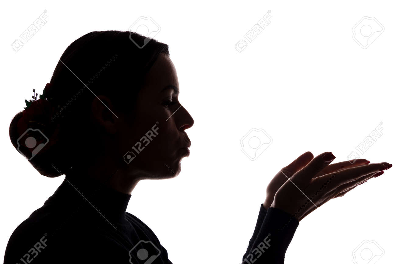 Young woman shows his hands forward, sending a kiss - silhouette - 150006908 Young woman shows his hands forward, sending a kiss - silhouette - 150006908