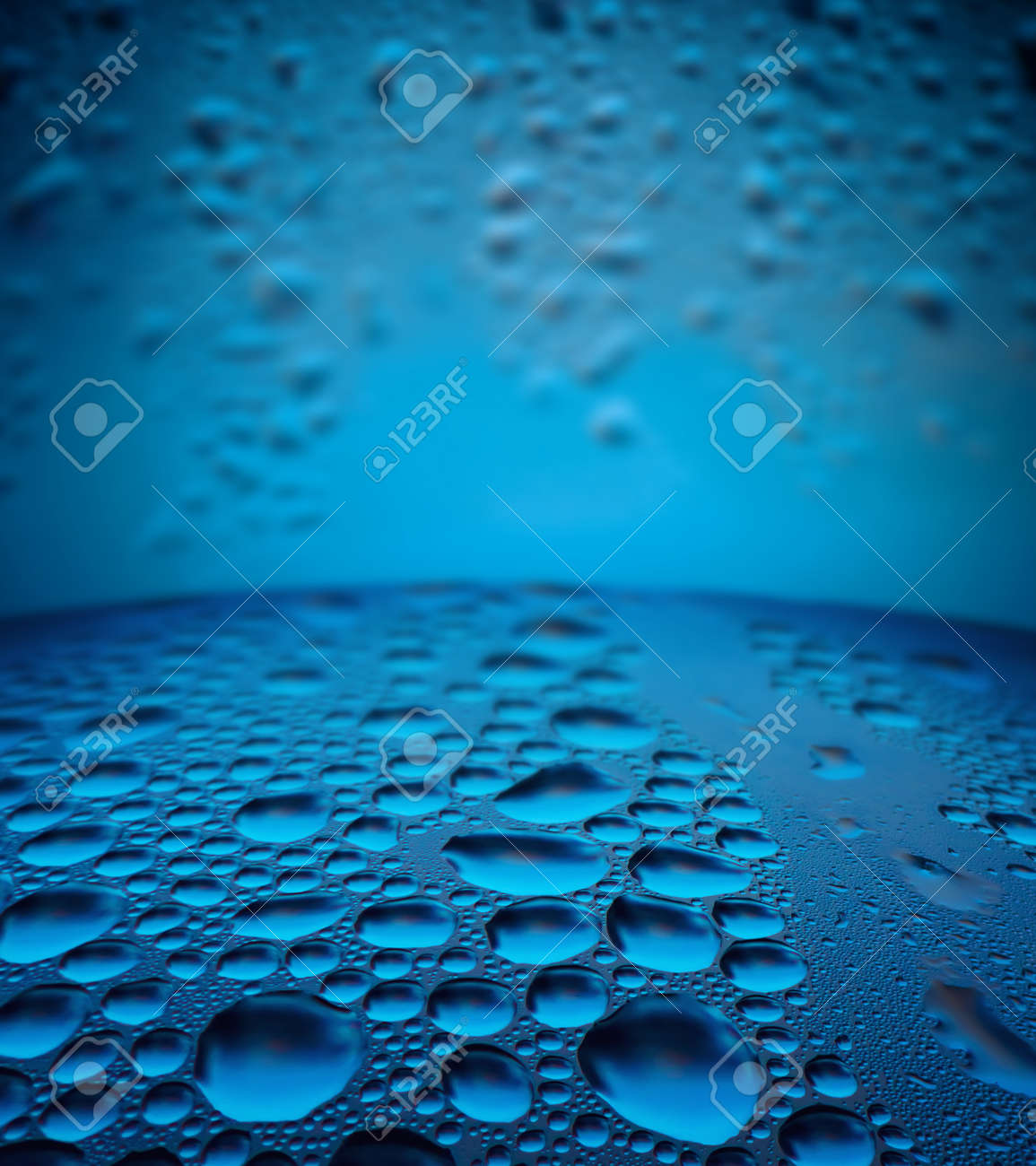 abstract blue background with water drops over glass surface - 140166816 abstract blue background with water drops over glass surface - 140166816