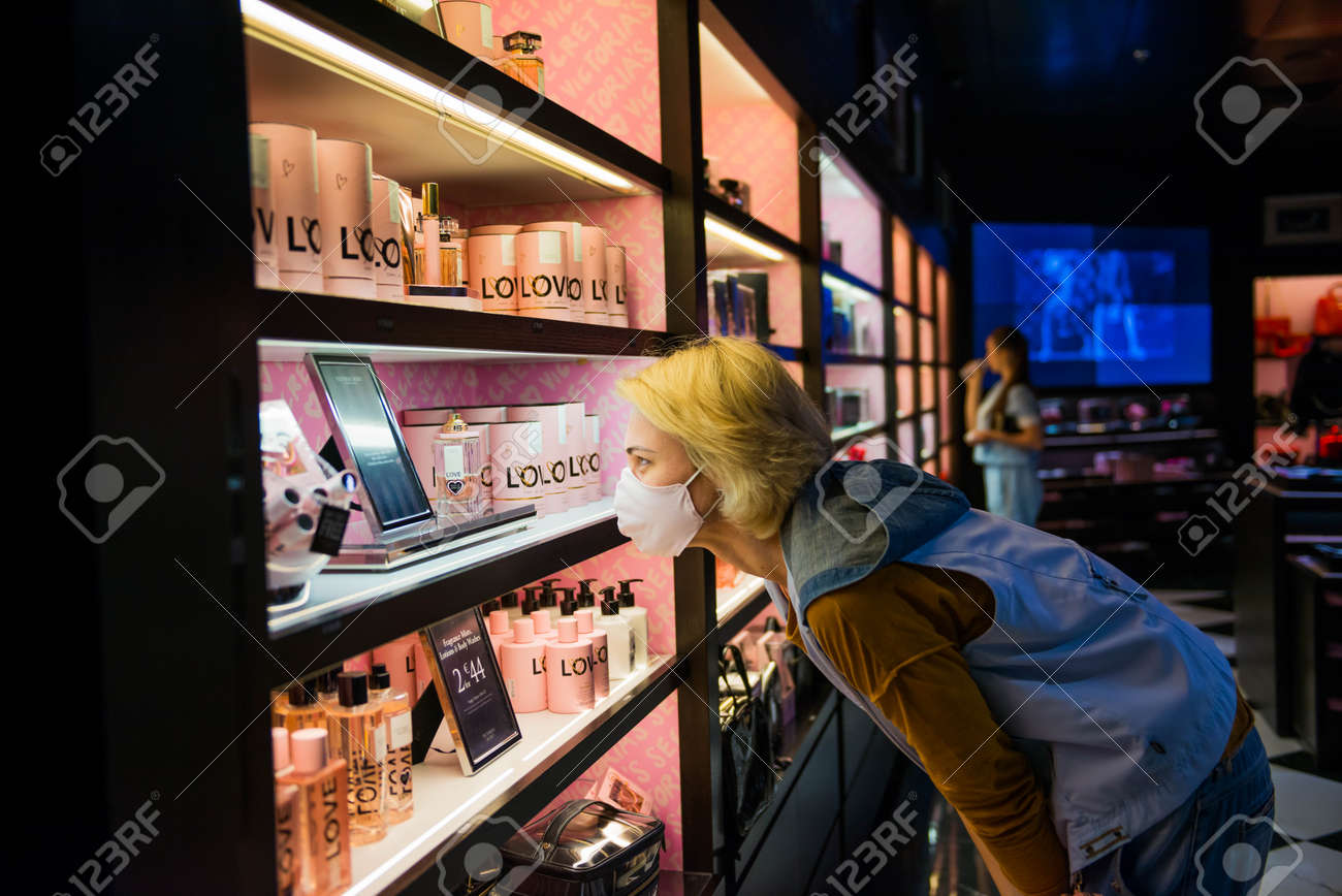 11.07.2020 - Kiev, Ukraine tourists woman in protective mask looking at shelf with famous brands in duty free shop - 154118510 11.07.2020 - Kiev, Ukraine tourists woman in protective mask looking at shelf with famous brands in duty free shop - 154118510