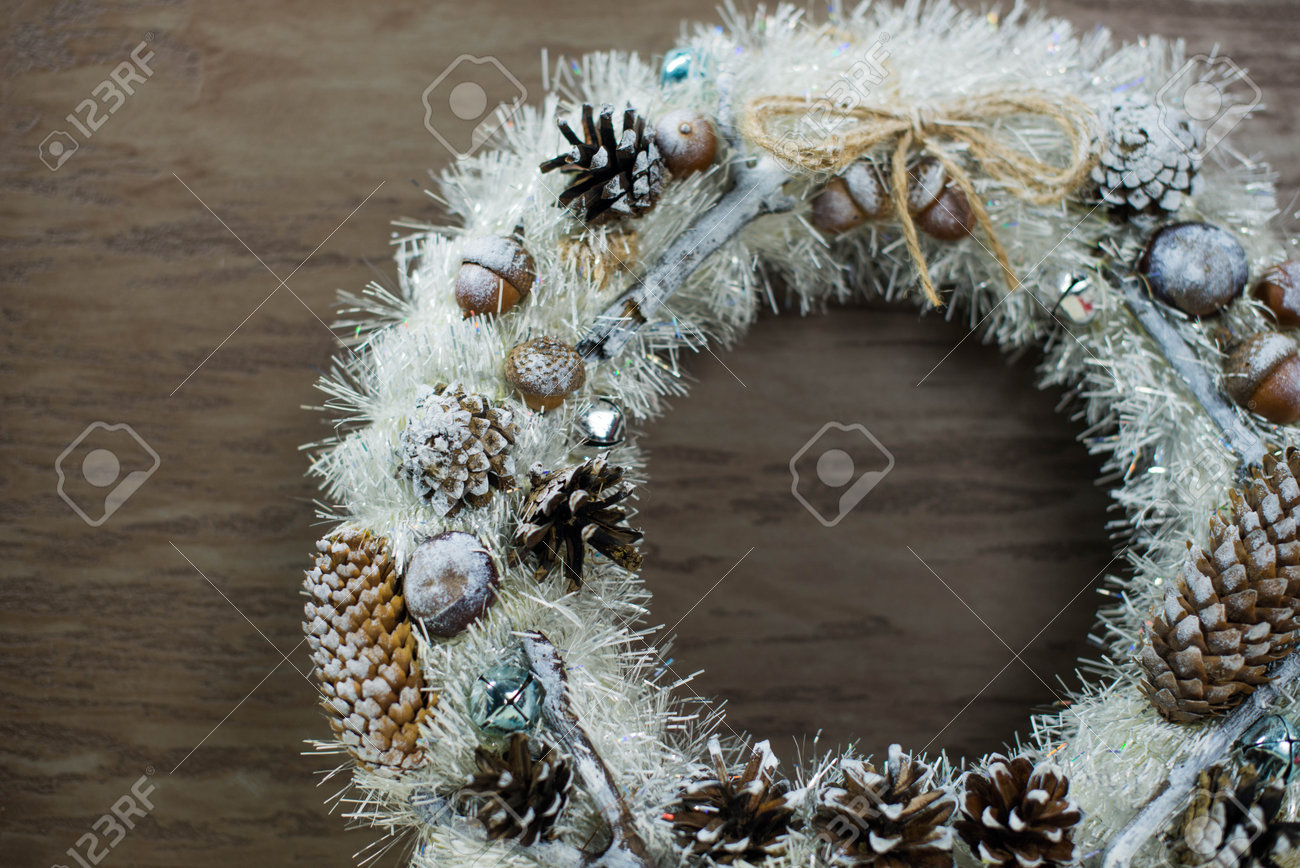 beautiful white Christmas wreath on brown wooden background - 160616116 beautiful white Christmas wreath on brown wooden background - 160616116