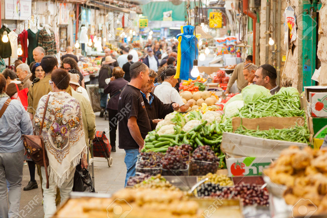 Jerusalem, Israel - November 15, 2012 - people are shopping at Mahane Yehuda - famous market in Jerusalem - 25454886 Jerusalem, Israel - November 15, 2012 - people are shopping at Mahane Yehuda - famous market in Jerusalem - 25454886