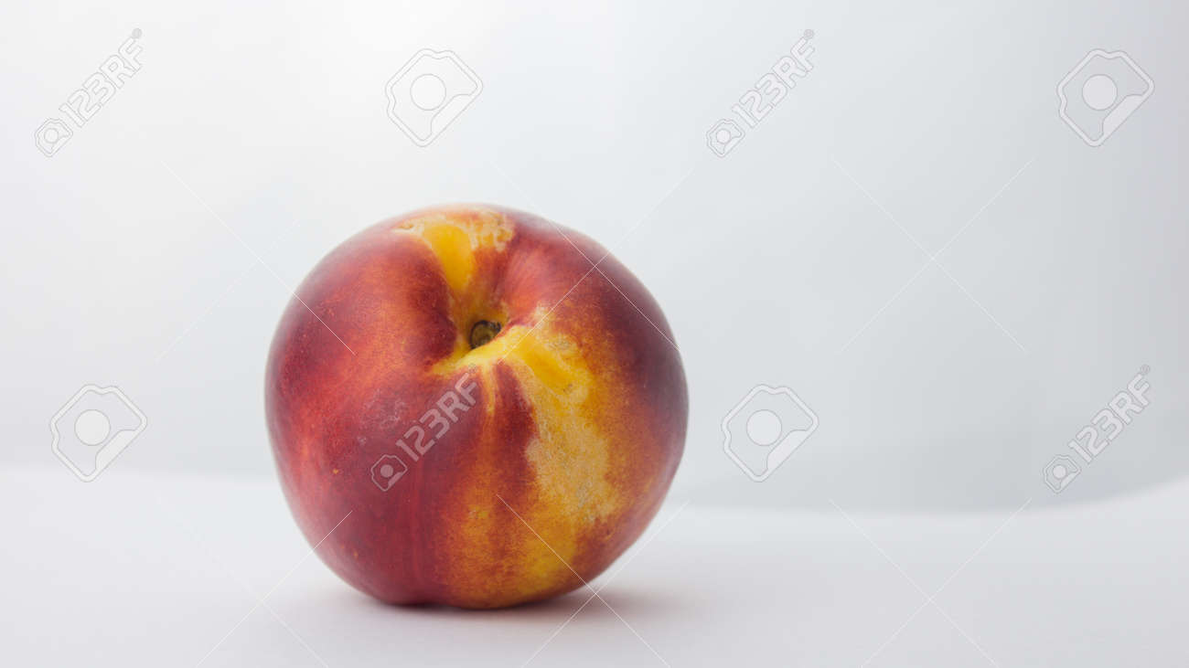 Fresh juicy peaches on a white plate. Close-up Fresh organic peaches nectarine on a white plate. - 152947788 Fresh juicy peaches on a white plate. Close-up Fresh organic peaches nectarine on a white plate. - 152947788