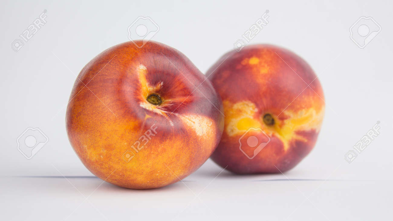 Fresh juicy peaches on a white plate. Close-up Fresh organic peaches nectarine on a white plate. - 152947789 Fresh juicy peaches on a white plate. Close-up Fresh organic peaches nectarine on a white plate. - 152947789