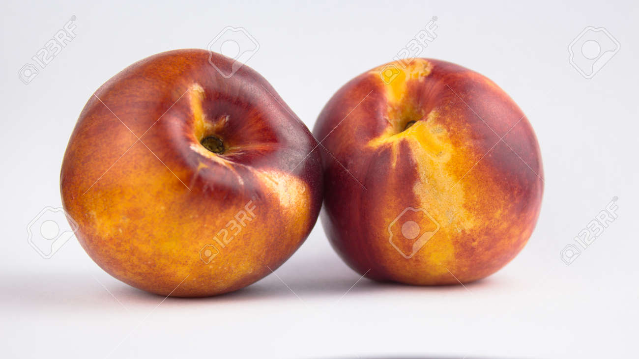 Fresh juicy peaches on a white plate. Close-up Fresh organic peaches nectarine on a white plate. - 152947793 Fresh juicy peaches on a white plate. Close-up Fresh organic peaches nectarine on a white plate. - 152947793