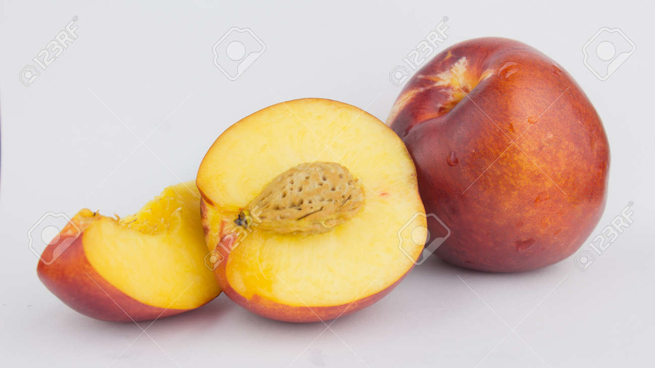 Fresh juicy peaches on a white plate. Close-up Fresh organic peaches nectarine on a white plate. - 152883450 Fresh juicy peaches on a white plate. Close-up Fresh organic peaches nectarine on a white plate. - 152883450