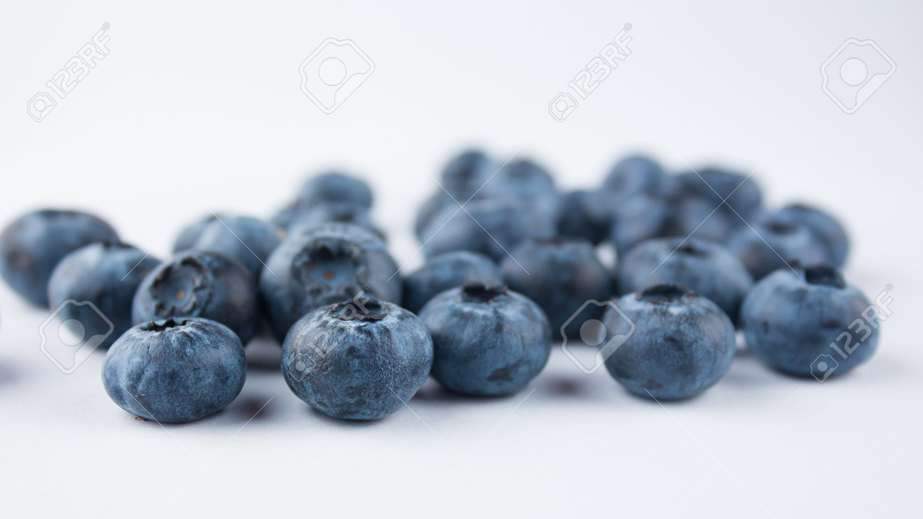 Close-up of ripe juicy blueberries on a white background. - 152883599 Close-up of ripe juicy blueberries on a white background. - 152883599