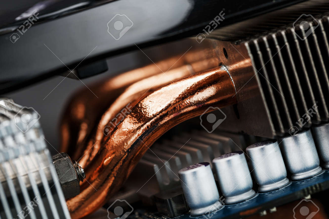Video card cooling system with copper pipes, aluminum radiators and fans. Video chip for gaming and cryptocurrency mining. Dark key - 169206407 Video card cooling system with copper pipes, aluminum radiators and fans. Video chip for gaming and cryptocurrency mining. Dark key - 169206407