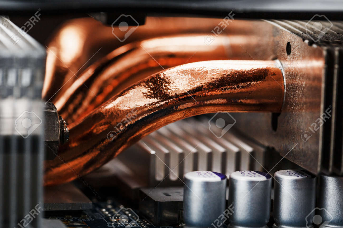 Video card cooling system with copper pipes, aluminum radiators and fans. Video chip for gaming and cryptocurrency mining. Dark key - 169206507 Video card cooling system with copper pipes, aluminum radiators and fans. Video chip for gaming and cryptocurrency mining. Dark key - 169206507