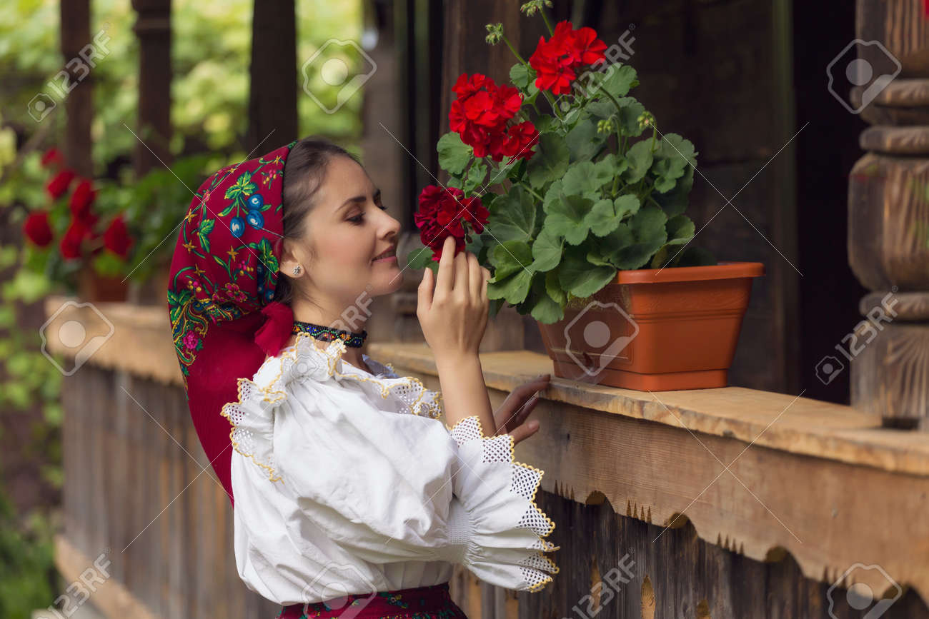 Portrait Of A Beautiful Young Woman Wearing Traditional Romanian Clothes,  In Maramures Stock Photo, Picture and Royalty Free Image. Image 102253329., image size:1300x867