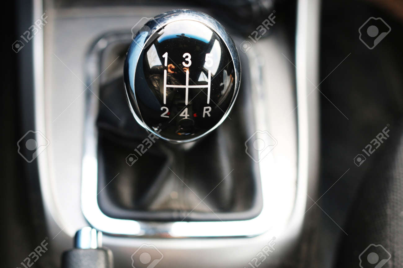 black shiny handle manual gearbox five-speed on the center of the frame Stock Photo
